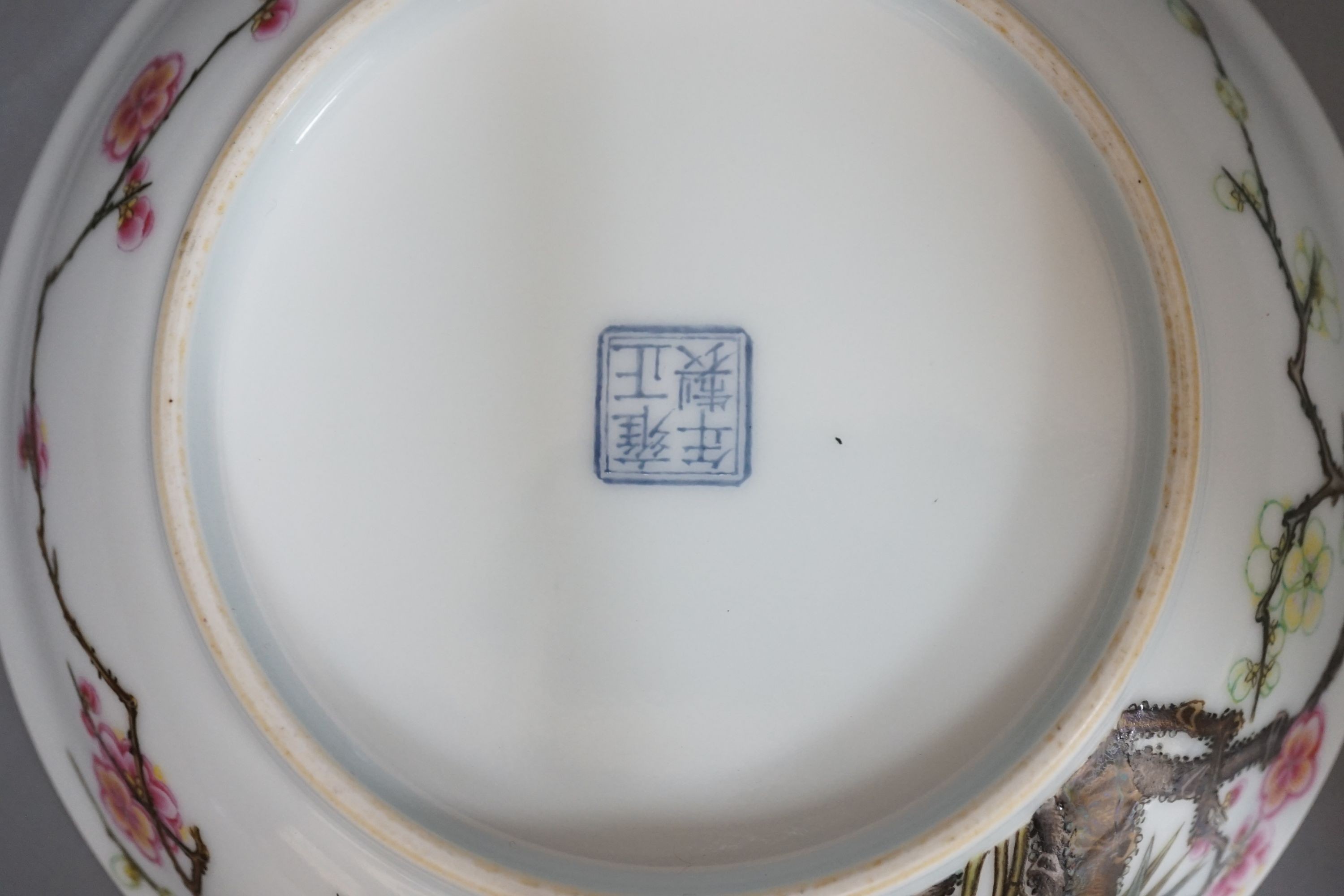 A boxed Chinese famille rose saucer dish, Yongzheng mark, 17 cms diameter.